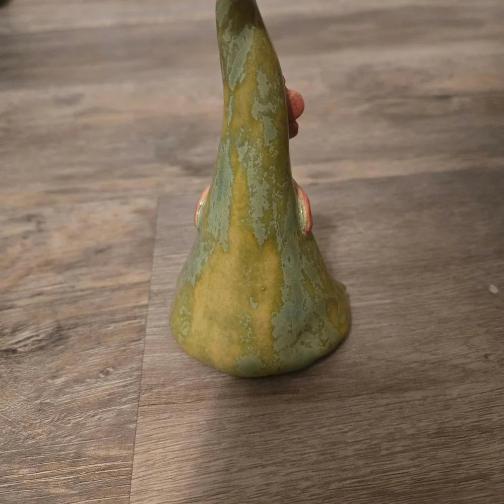 Small green gnome sculpture